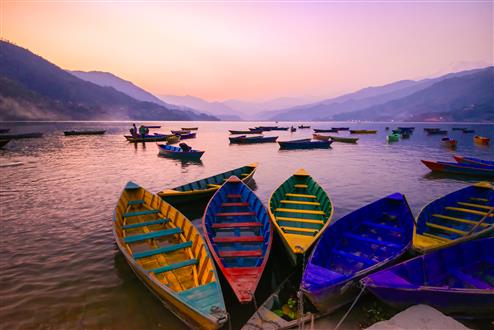 The Royal Walk in the Himalayas twilight with boats on Phewa lake, Pokhara, Nepal (Custom).jpg